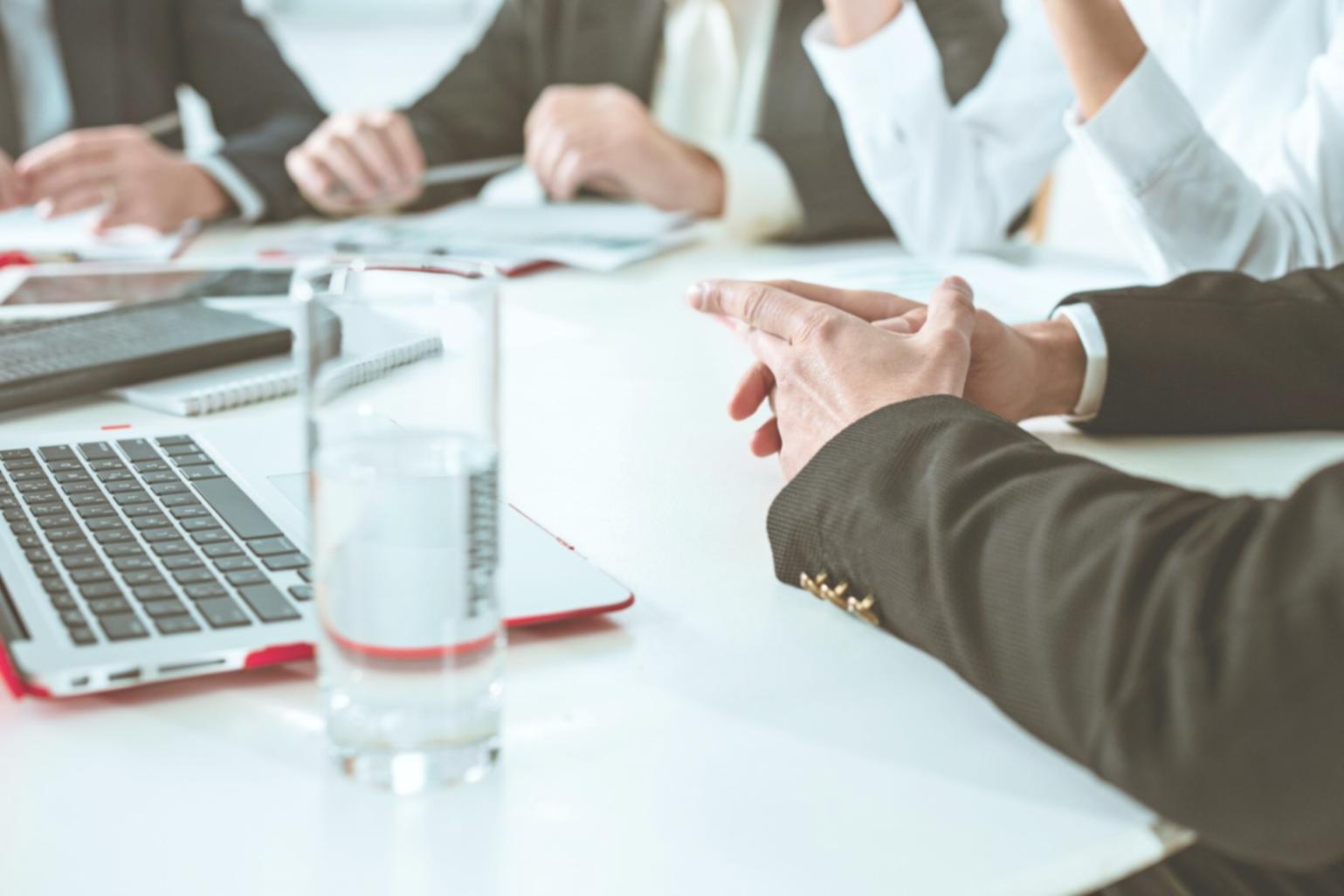 Finance professional reviewing detailed budget reports with variance analysis